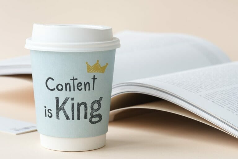 "Content is King" written on a coffee cup.